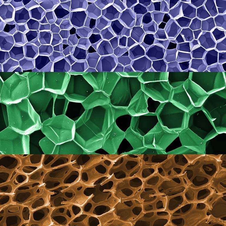three horizontally tiled layers of web-like structures at various scales, in purple, green, and brown