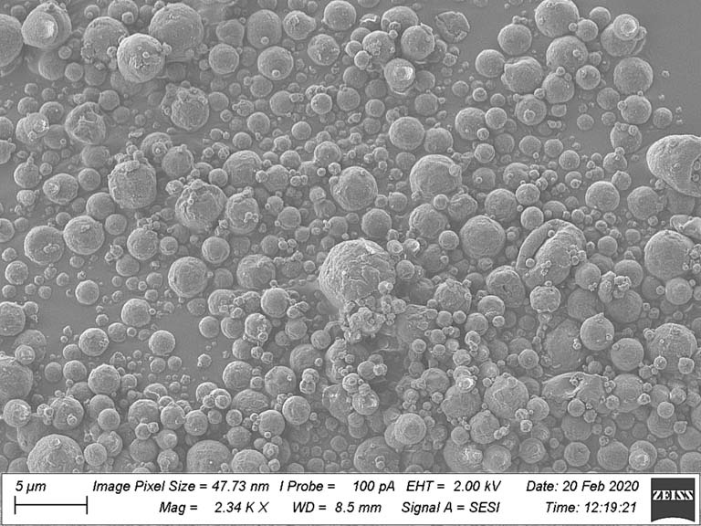 a field of small grey spheres, packed together at various densities