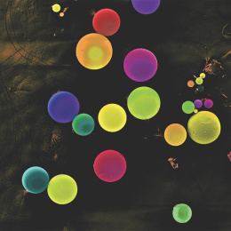 colorful spheres on a mottled black background