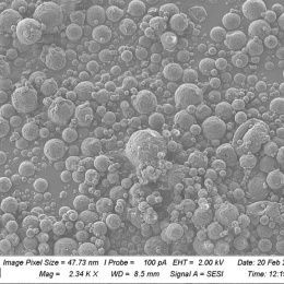 a field of small grey spheres, packed together at various densities
