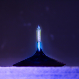 A glowing column with a gradient of blue to dark blue mounted on a triangular indigo base